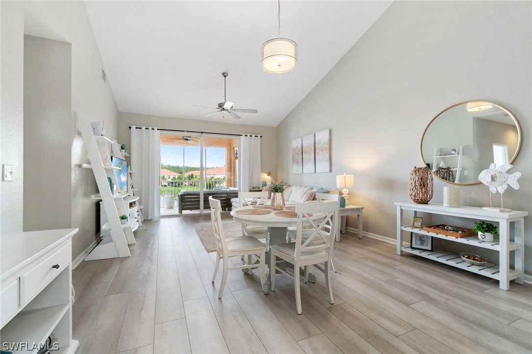 a view of a dining room with furniture window and wooden floor