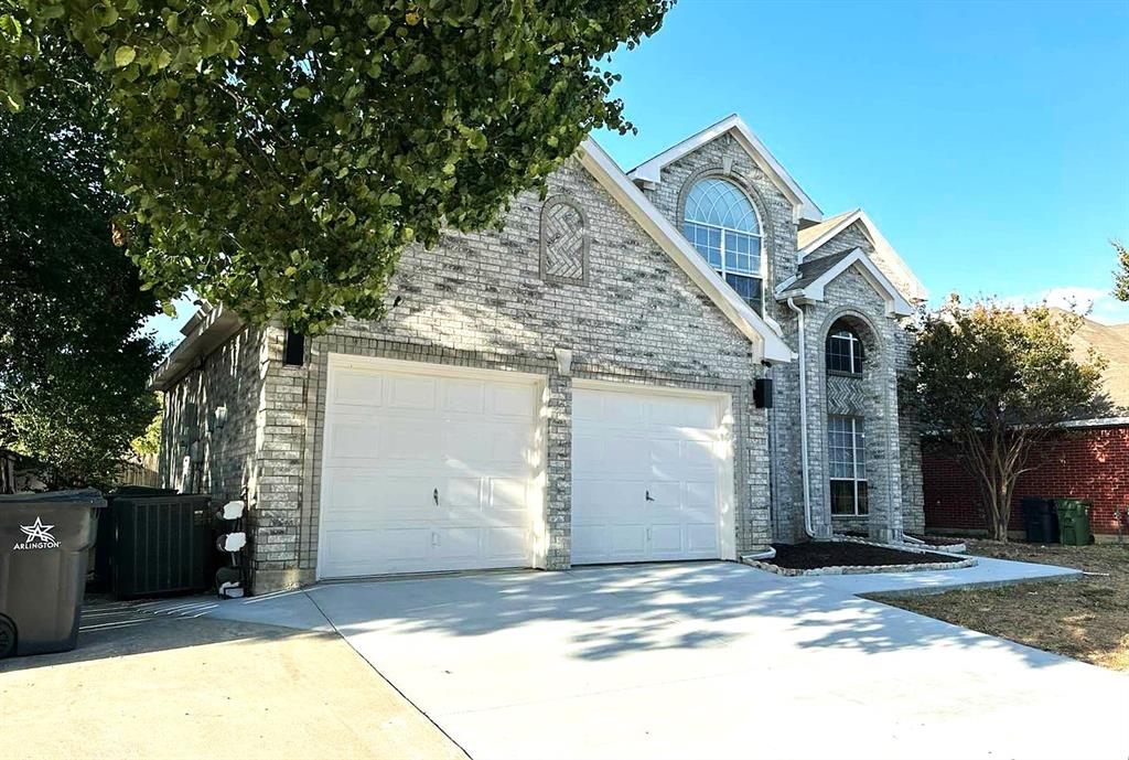 a front view of a house with a garage