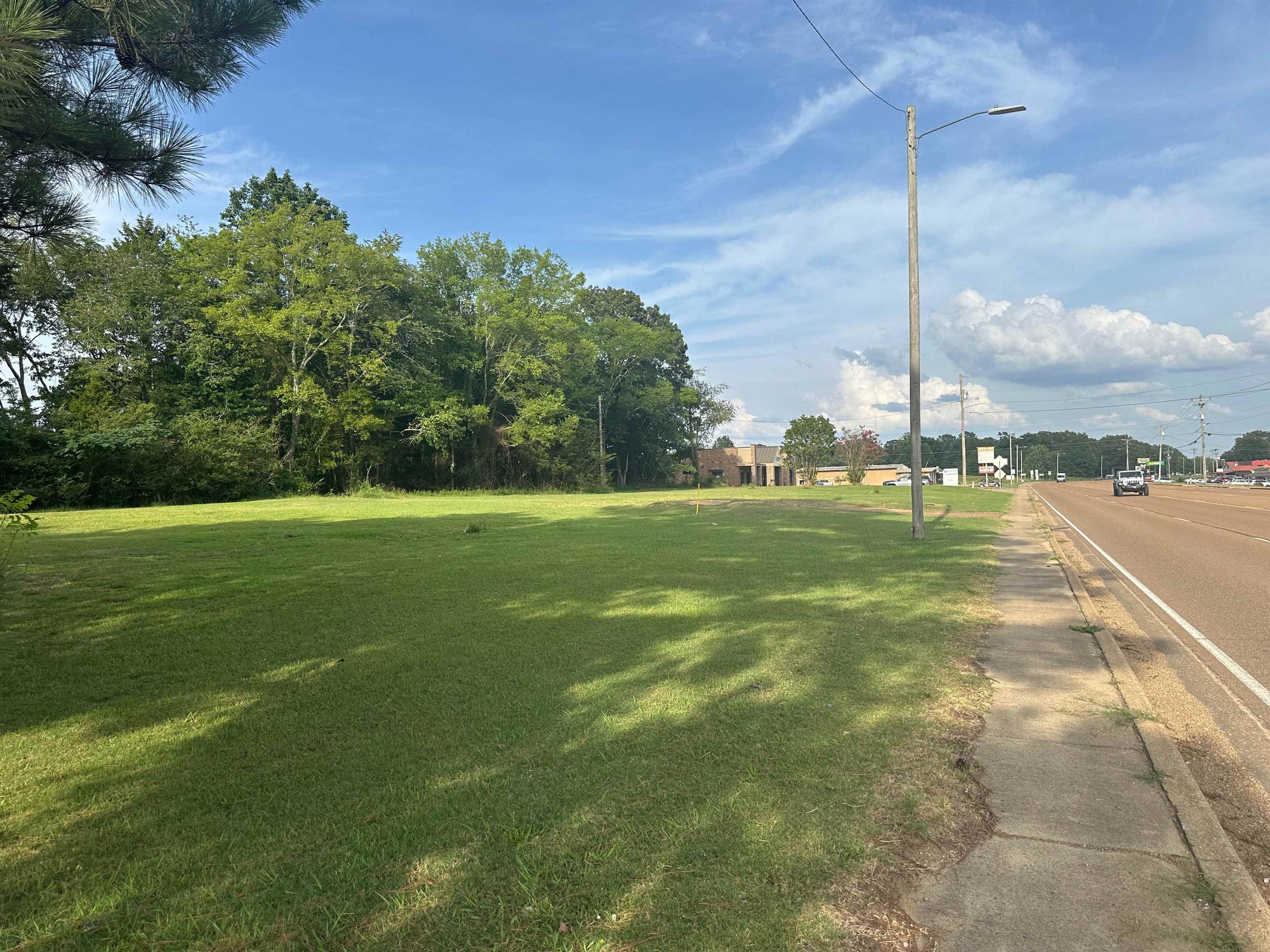 a view of a building with a big yard