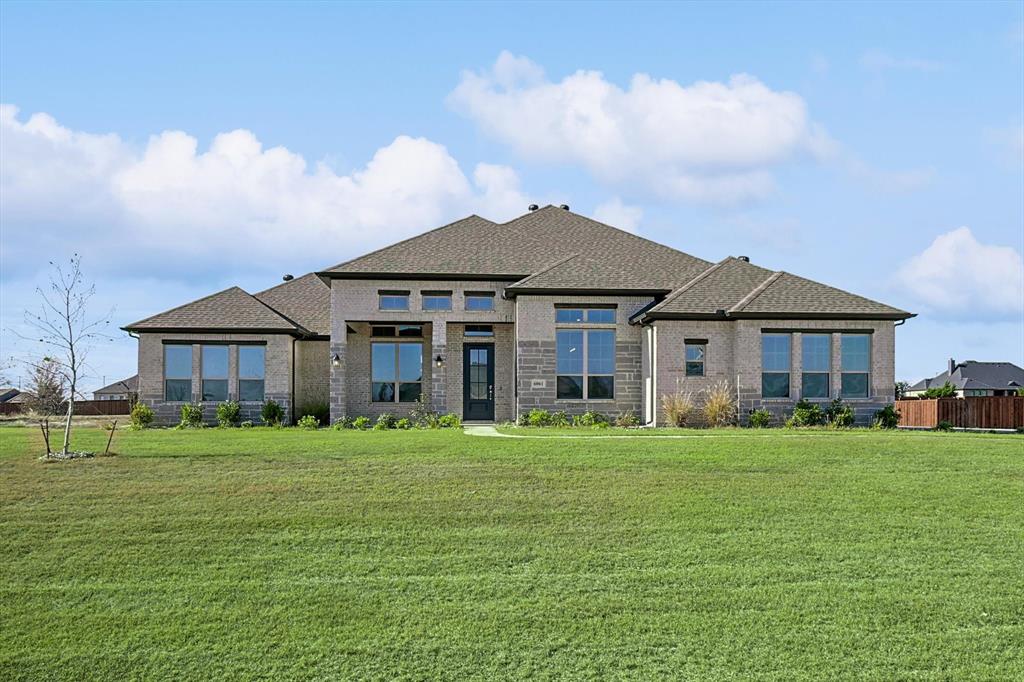 a big house with a big yard and large trees