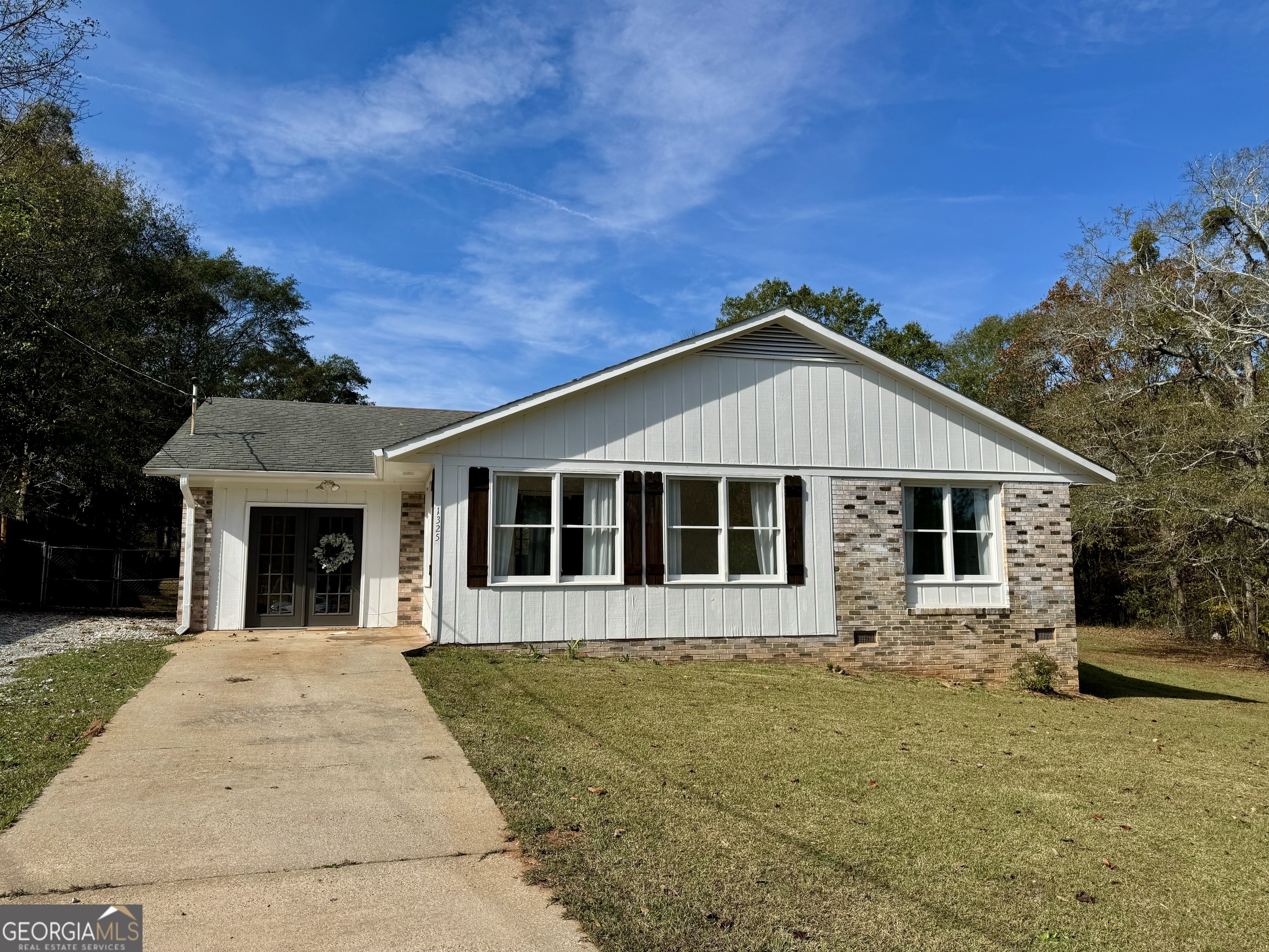 a front view of a house with yard