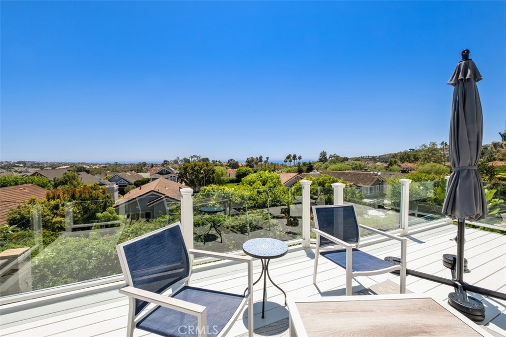 a view of a chairs and table in patio