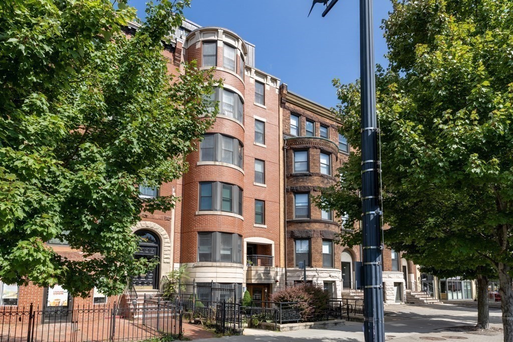 a front view of a building with street view