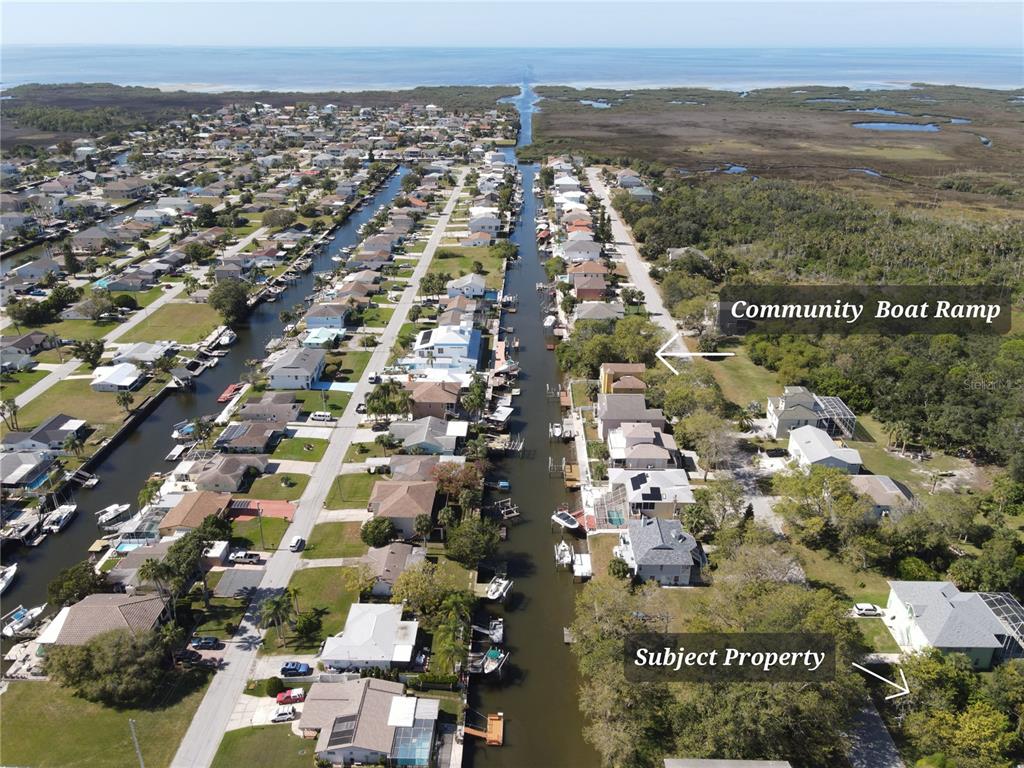 an aerial view of residential building with parking