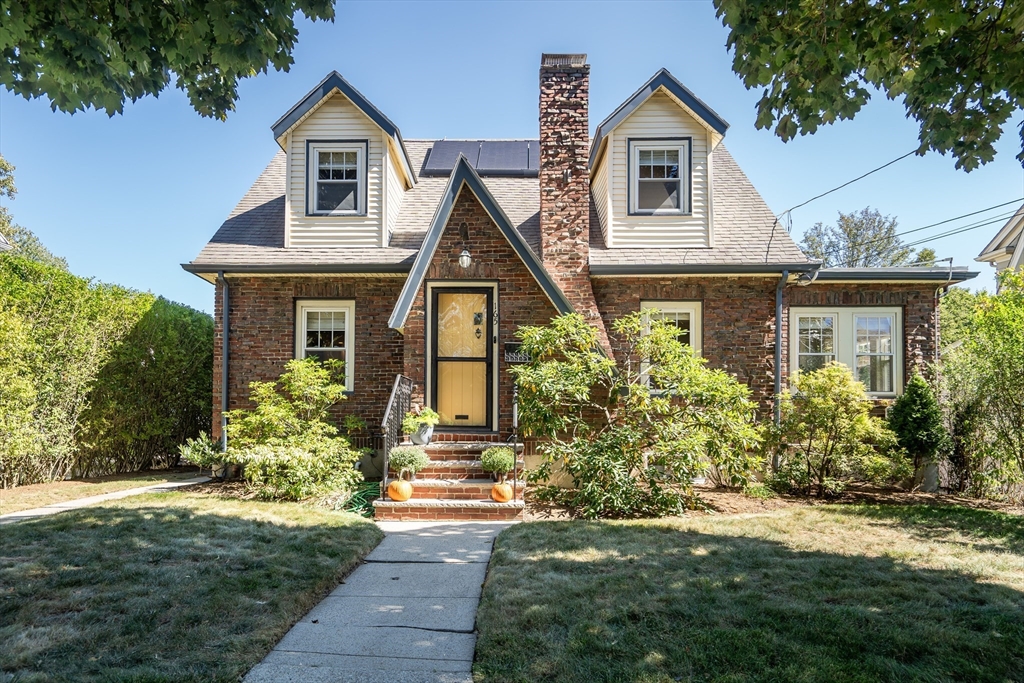 a front view of a house with garden