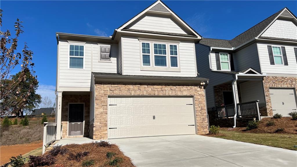 a front view of a house with a garage