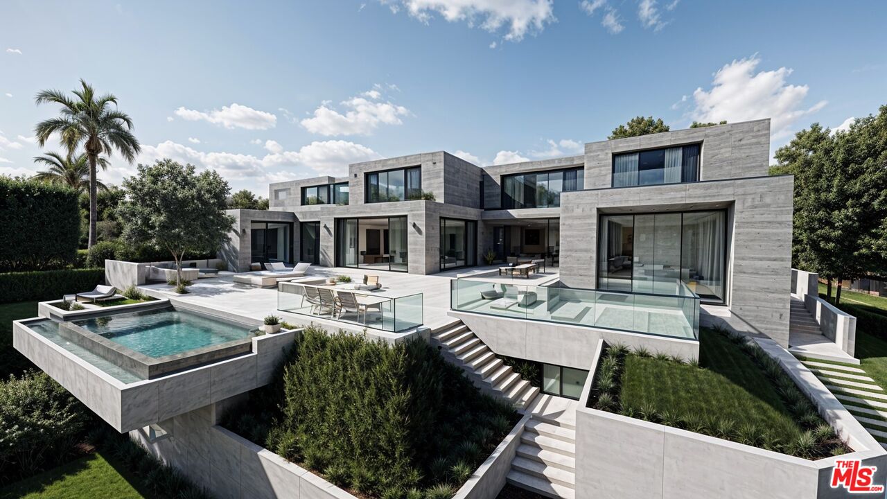 a view of a house with swimming pool and furniture