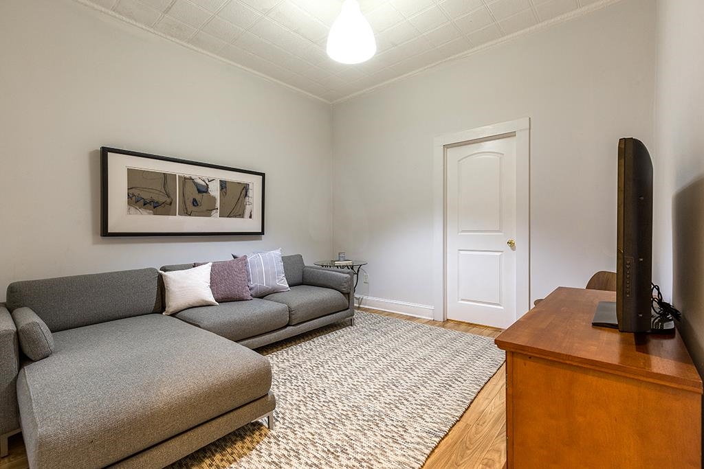 a living room with a couch and a flat screen tv