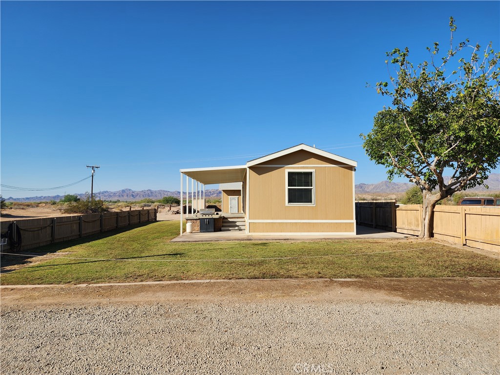 a view of a house with a big yard