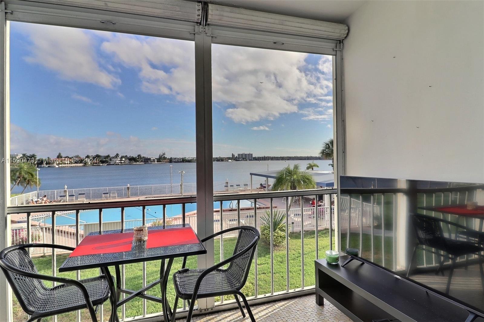 a view of a chairs and table in the balcony