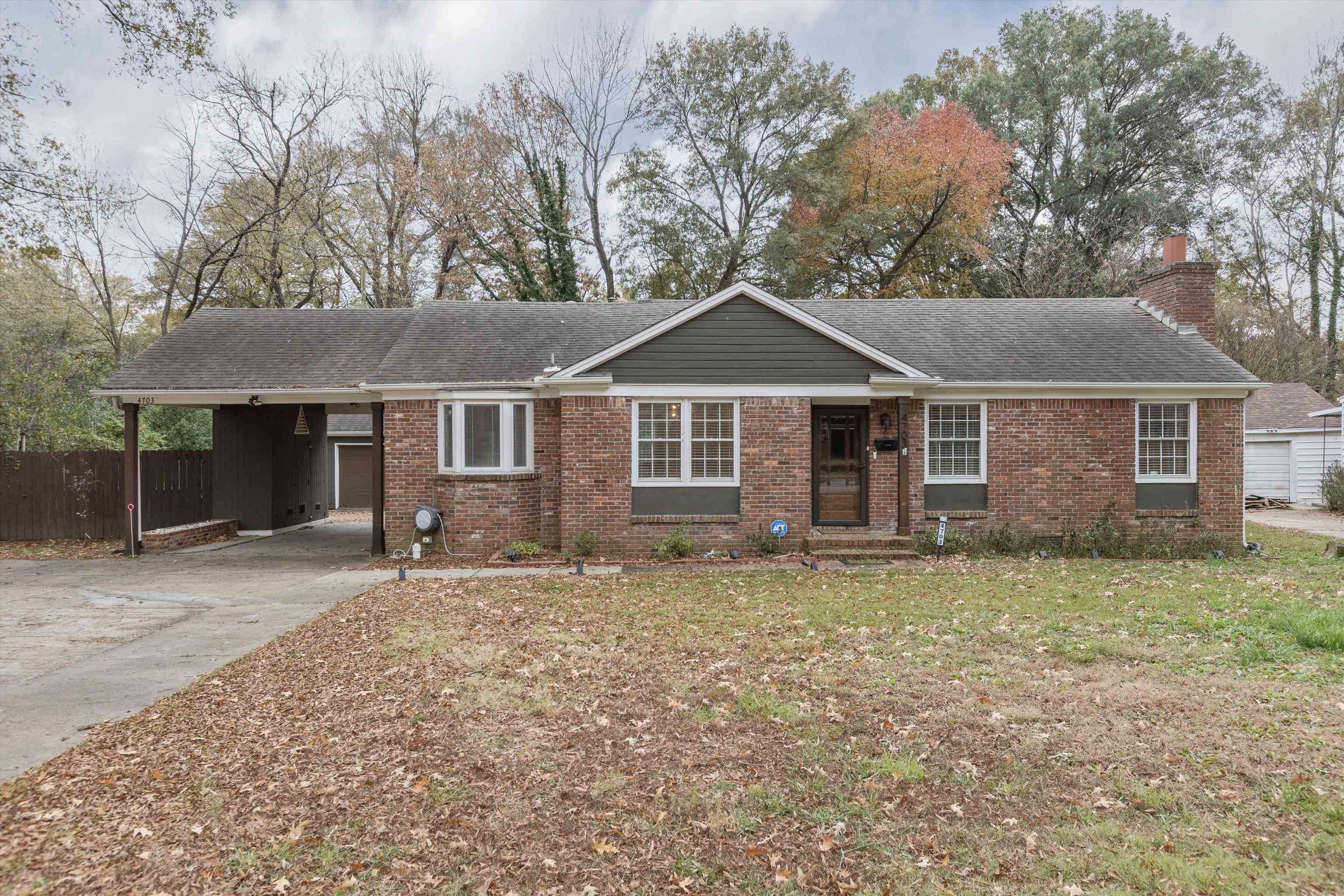 Single story home featuring a carport