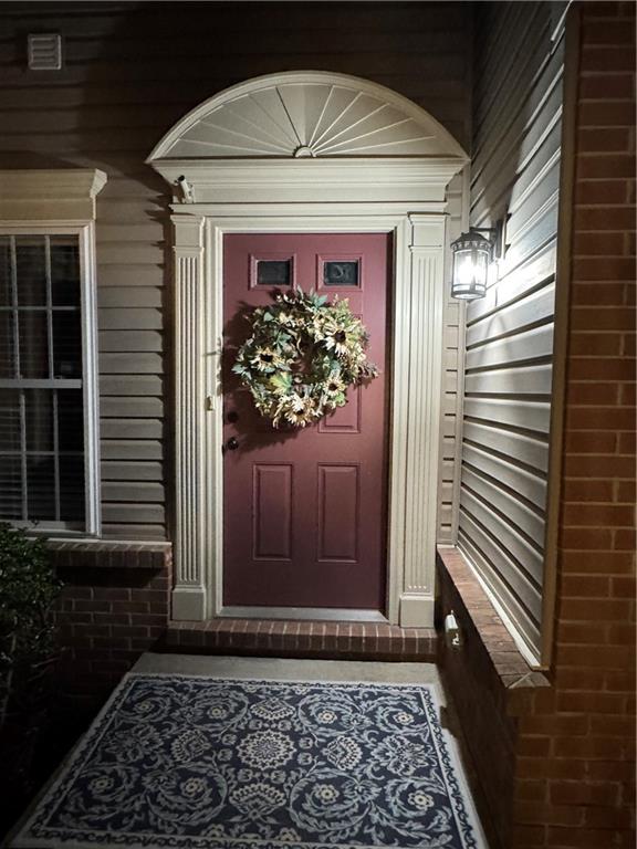 a view of a door and a window