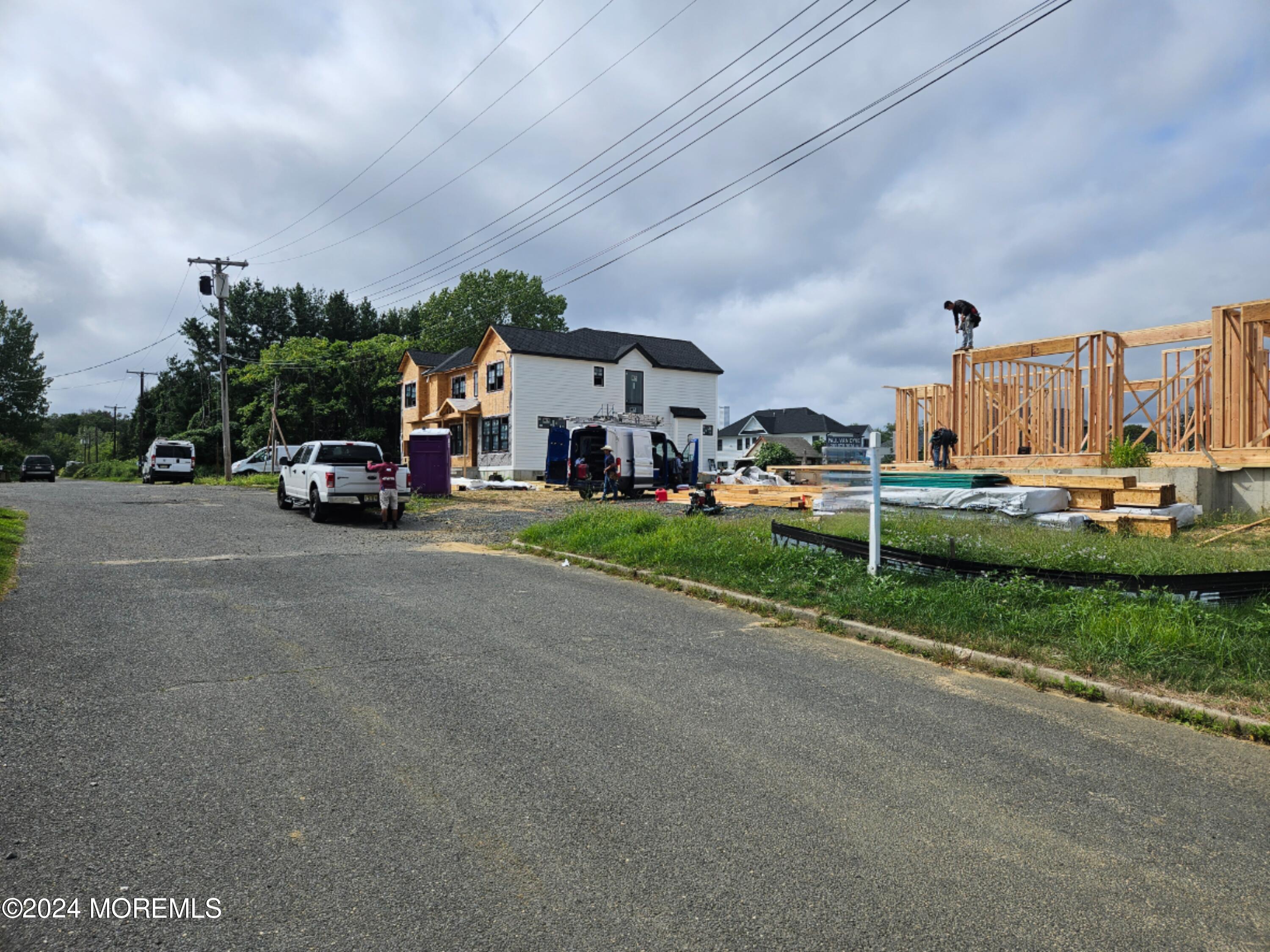 a view of street with parked cars