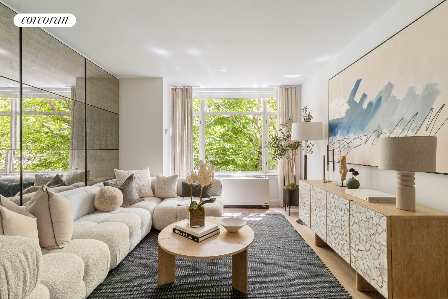 a living room with furniture and a large window