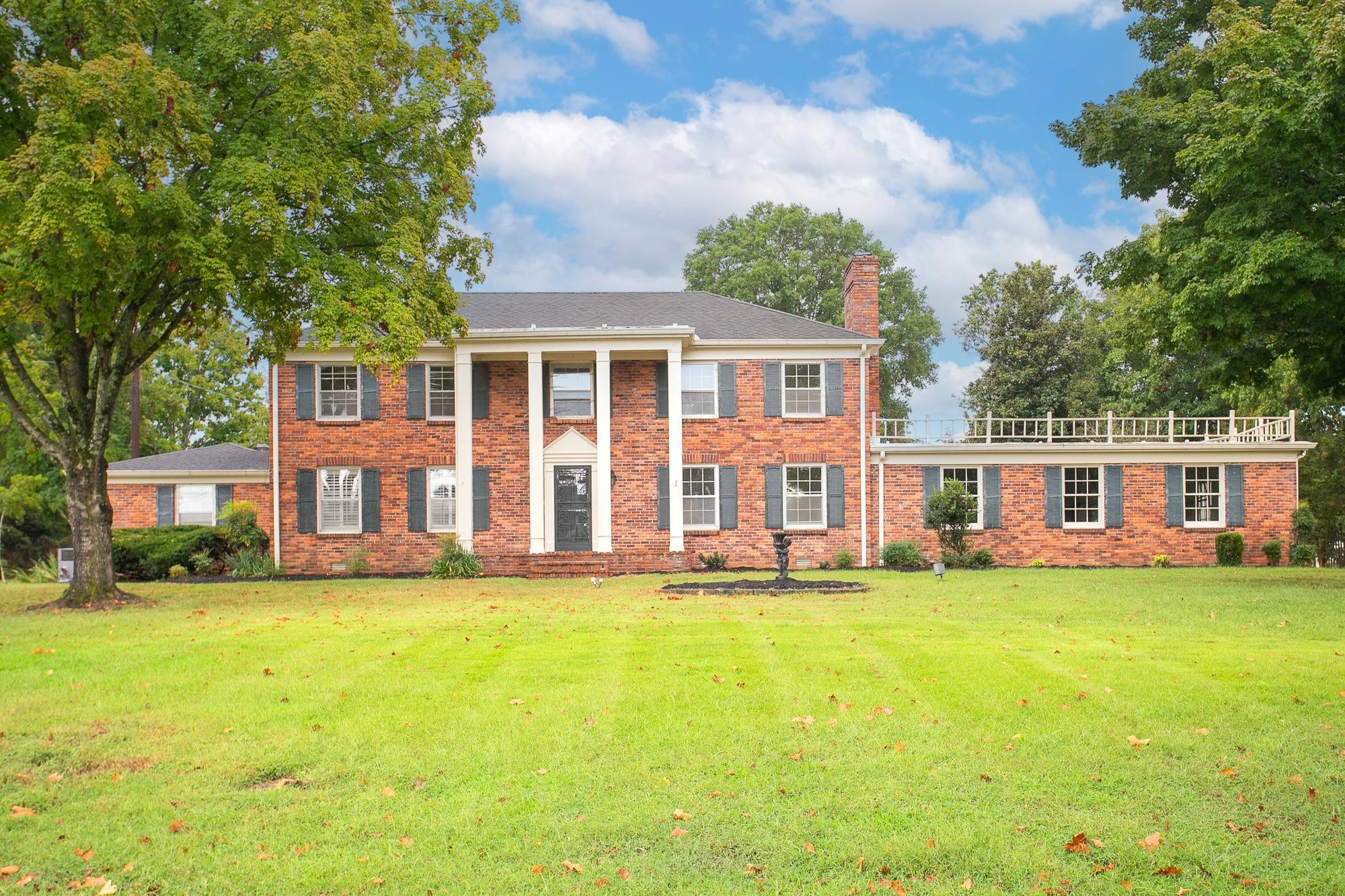 front view of a house with a yard