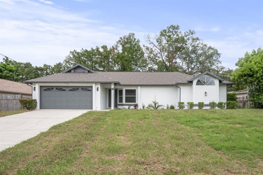 front view of a house with a yard