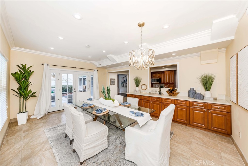 a large kitchen with a table and chairs