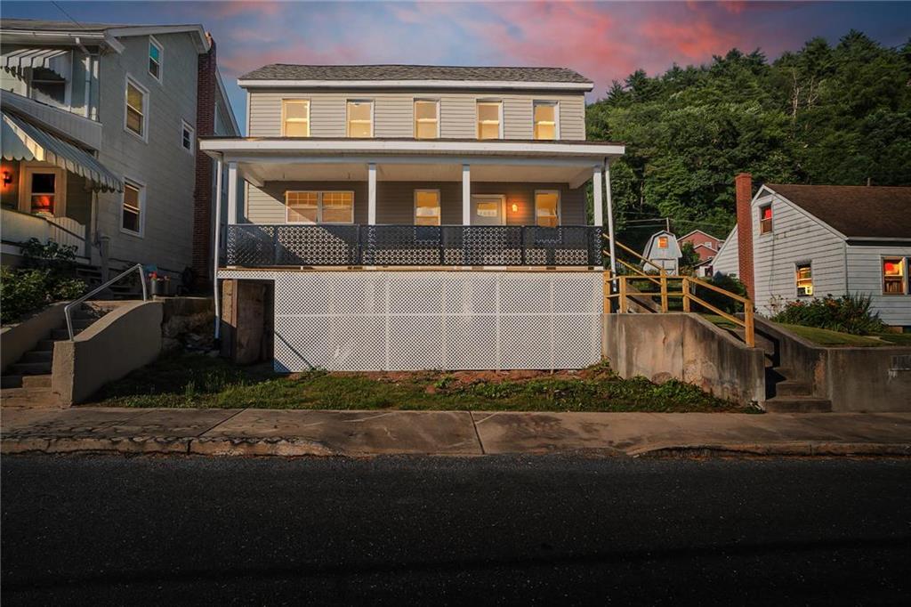 a front view of a house with a yard