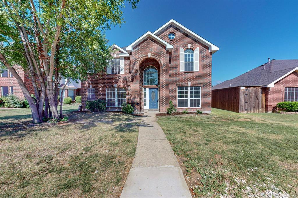 front view of a house with a yard