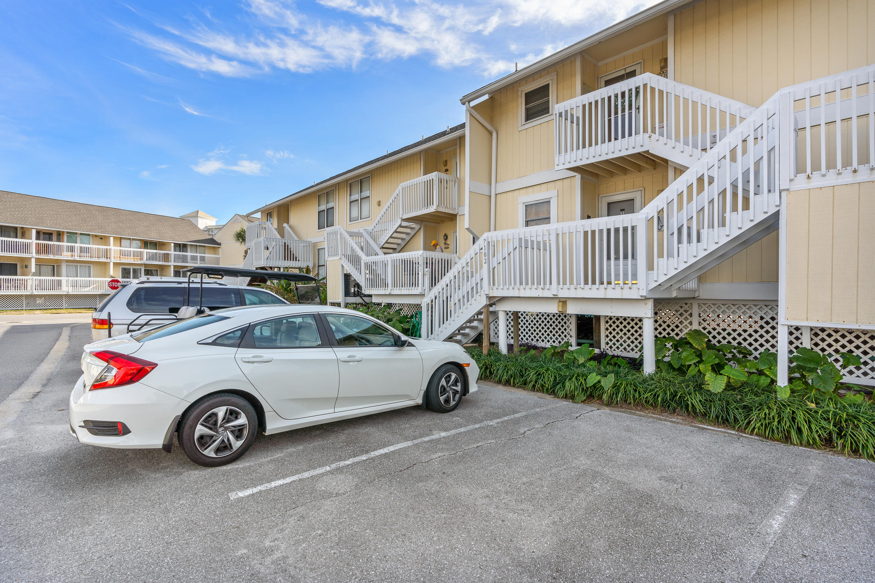 a view of a car parked in front of a house