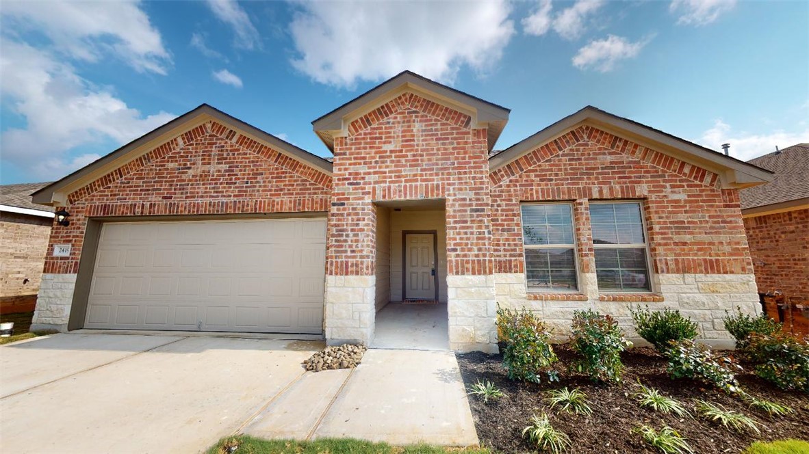 View of front property with a garage