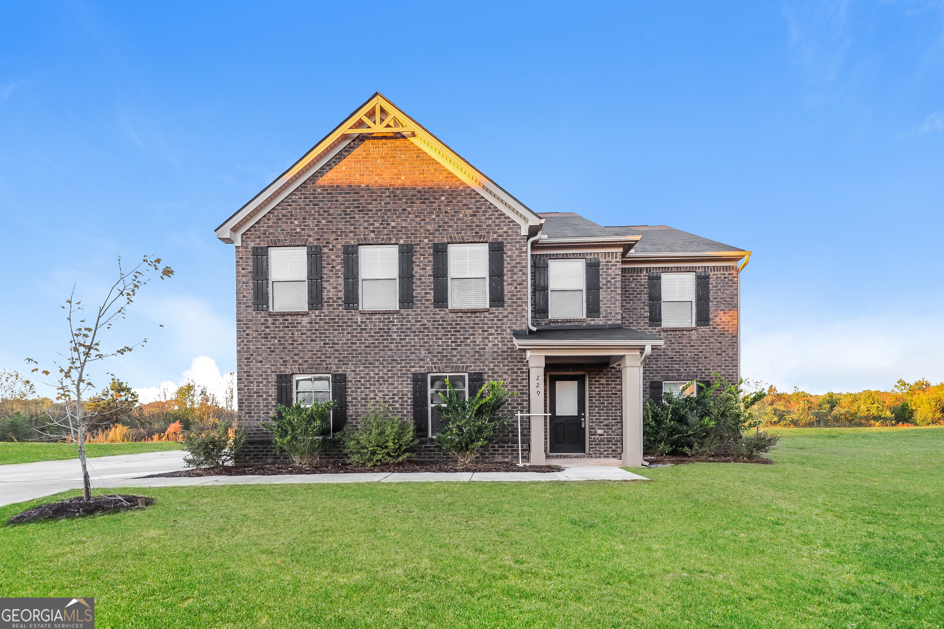 front view of a house with a yard