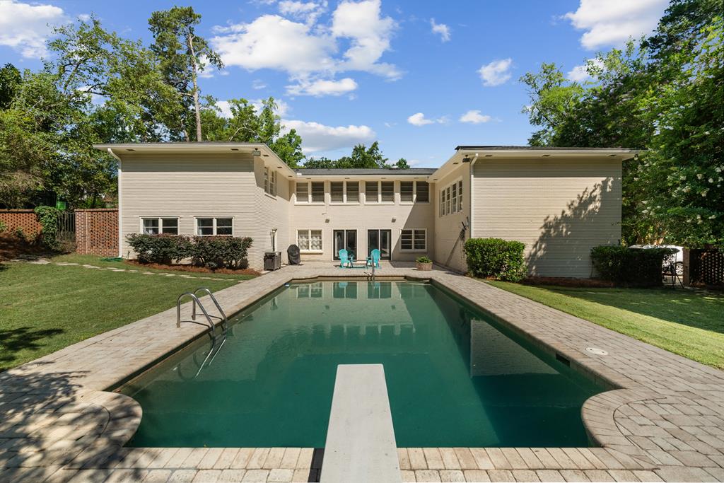 a view of a swimming pool with a patio