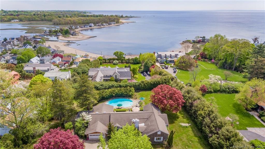 an aerial view of a house with a garden and swimming pool