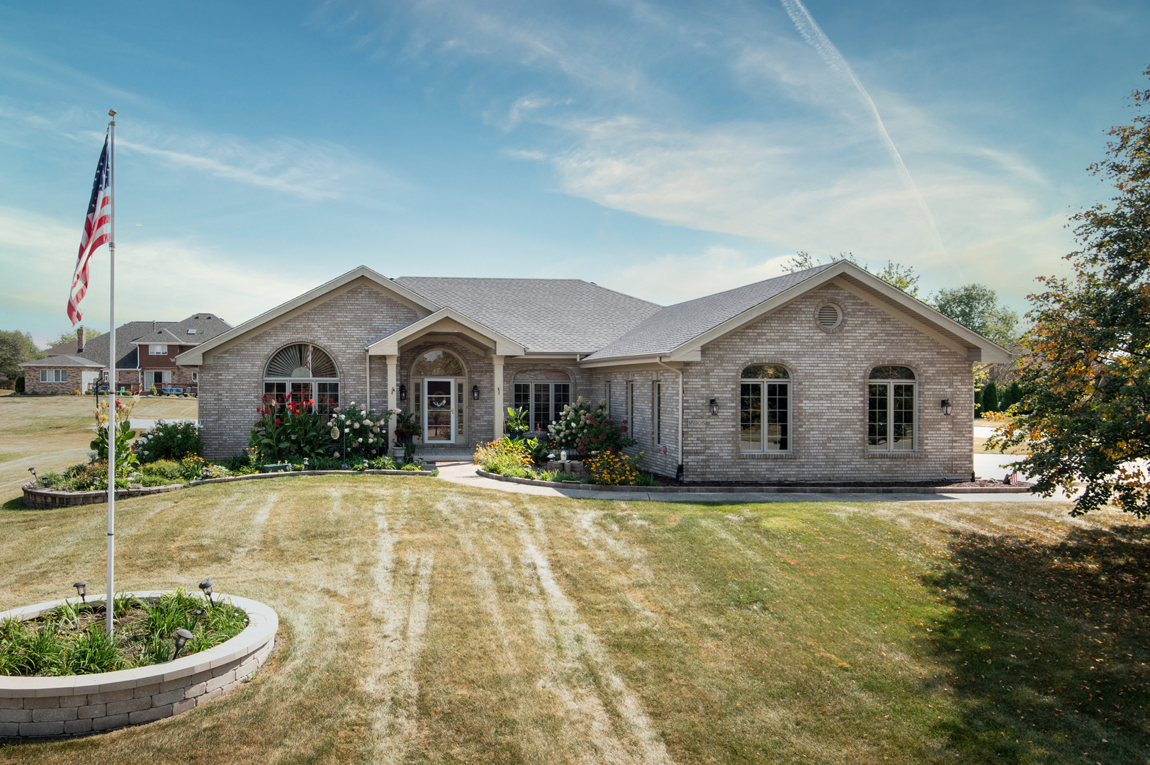 a front view of a house with garden