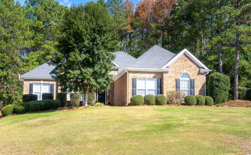 a front view of a house with a yard