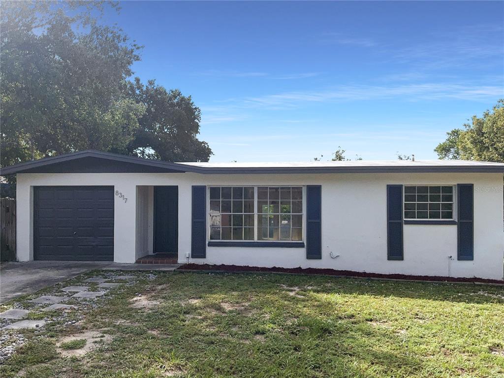 front view of a house with a yard