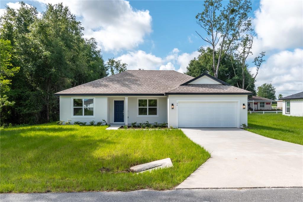 a view of a house with a yard