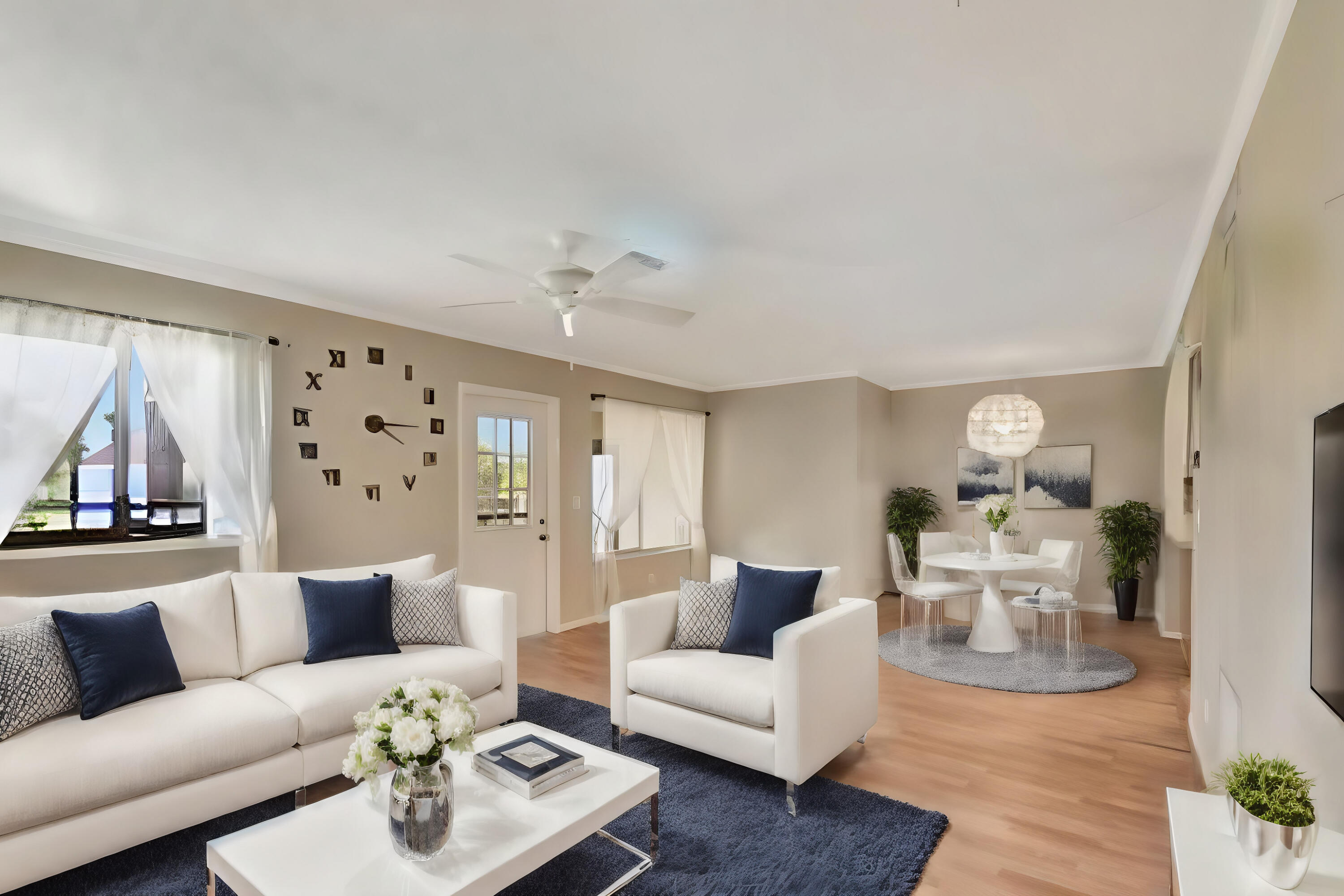 a living room with furniture and wooden floor