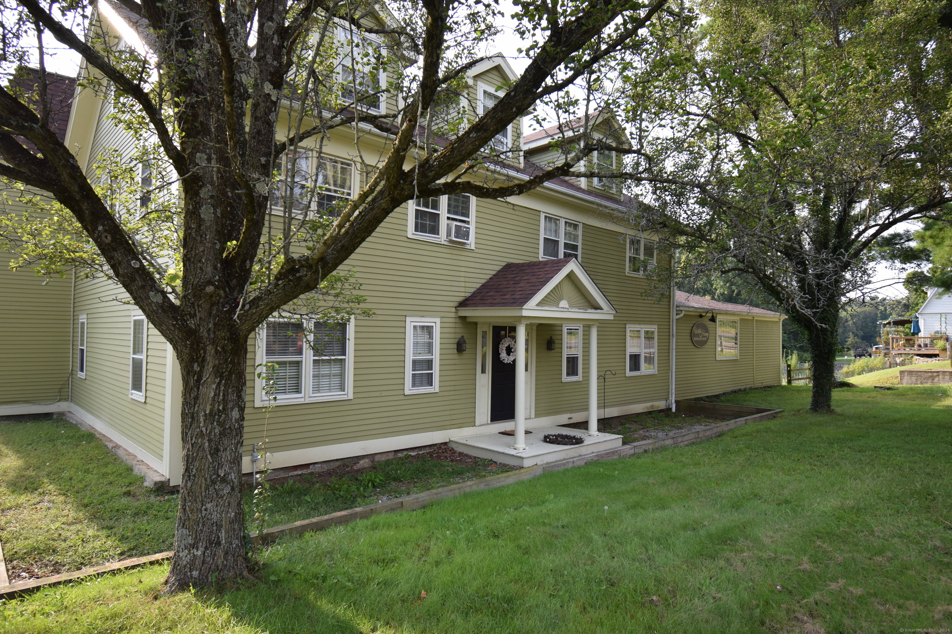 a front view of a house with a yard