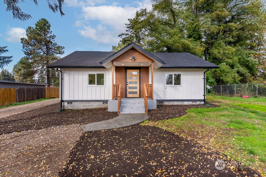 a house with trees in the background