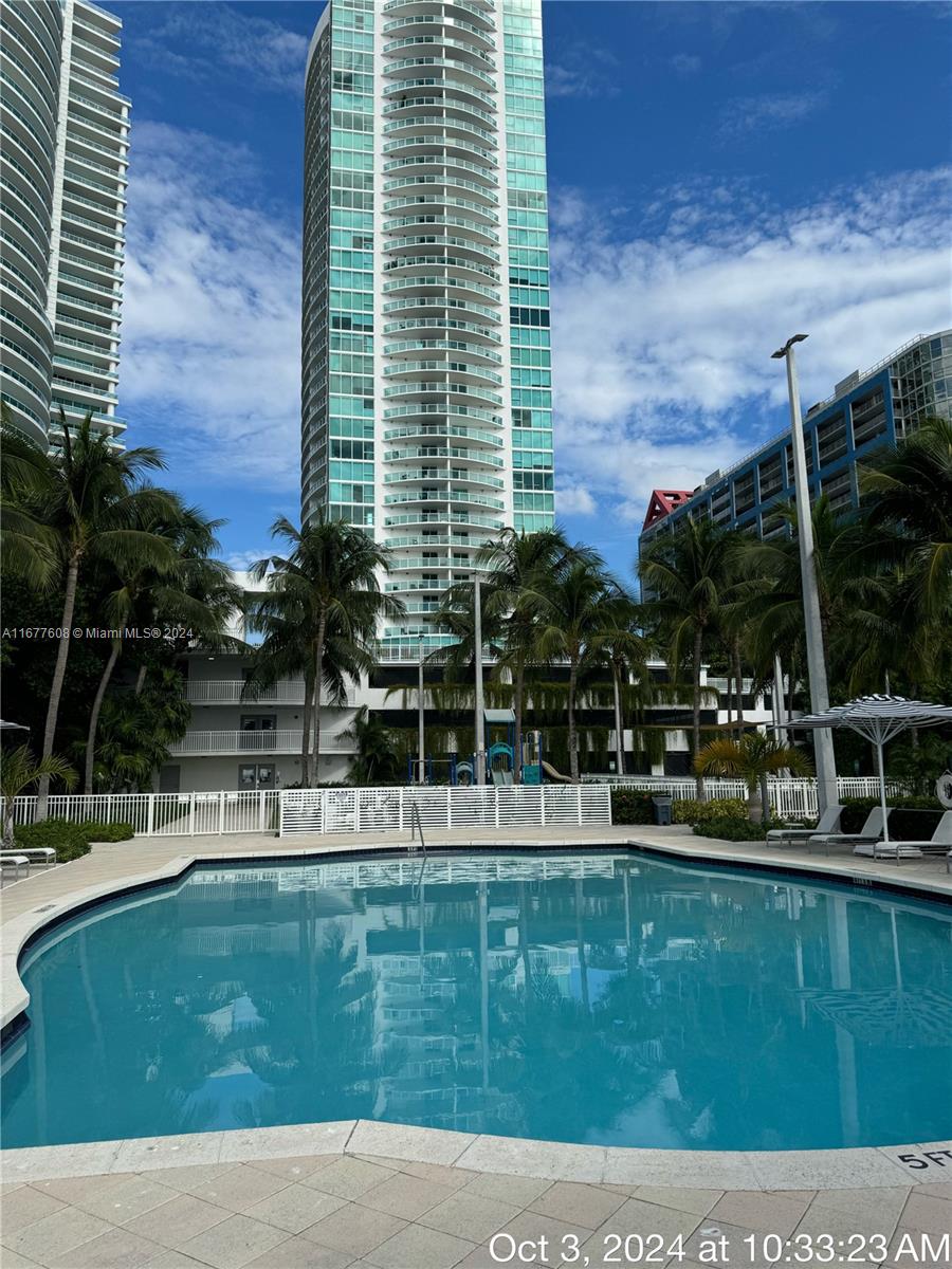 a house view with swimming pool