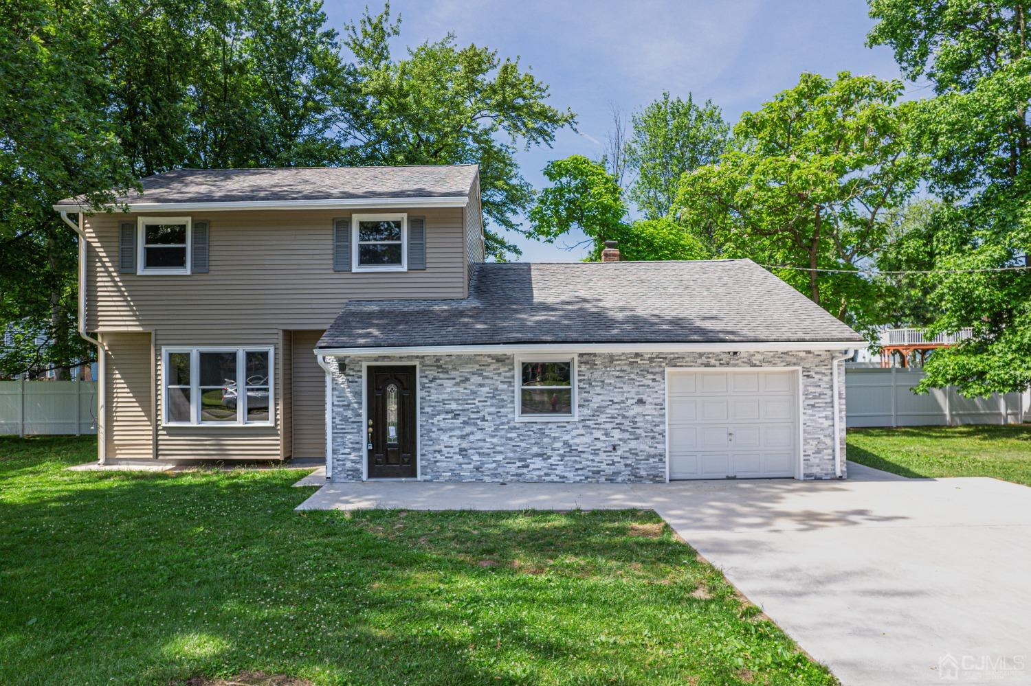 front view of a house with a yard