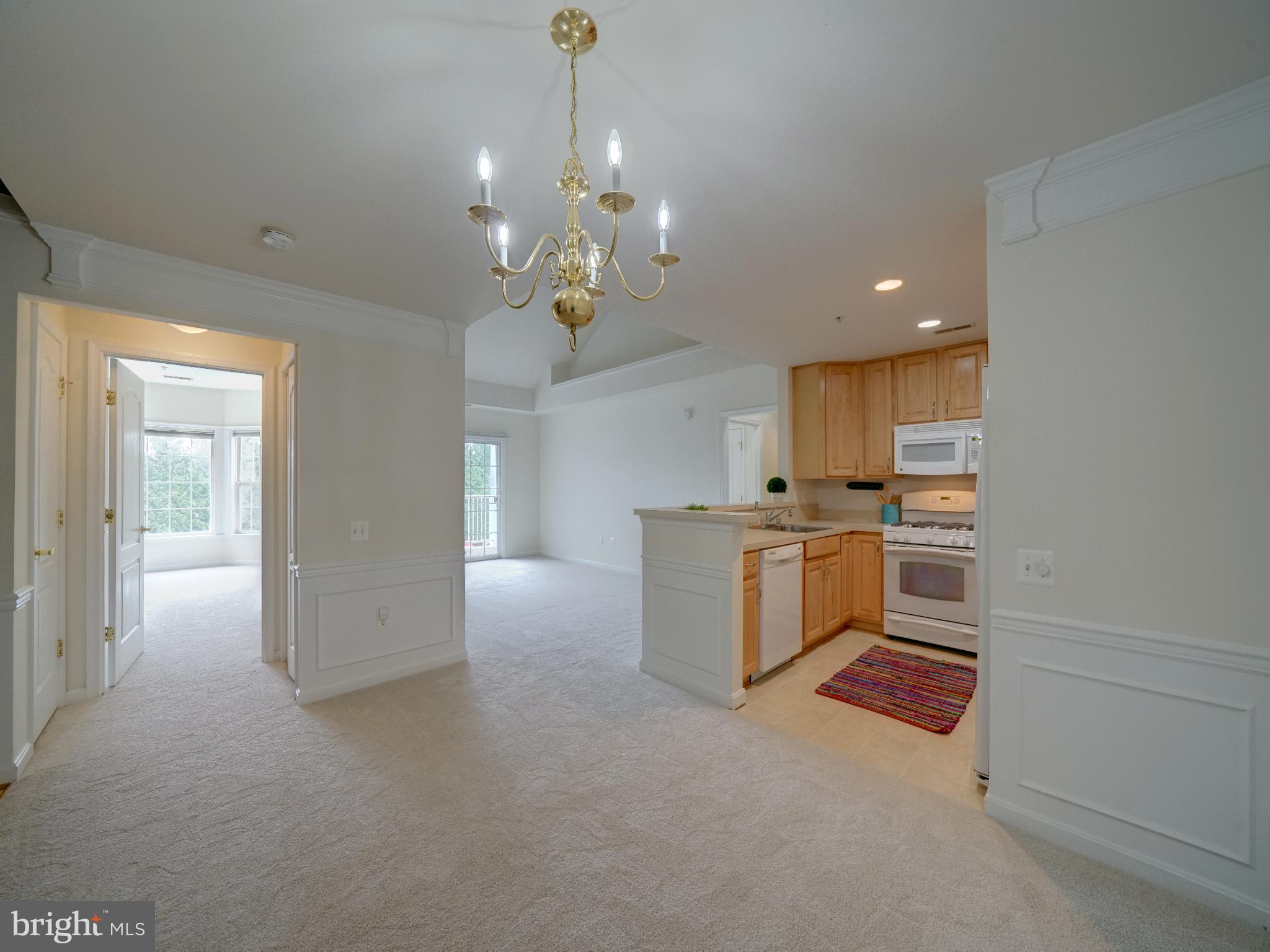 a kitchen with stove and cabinets