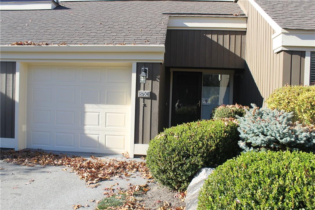 Property entrance with a garage