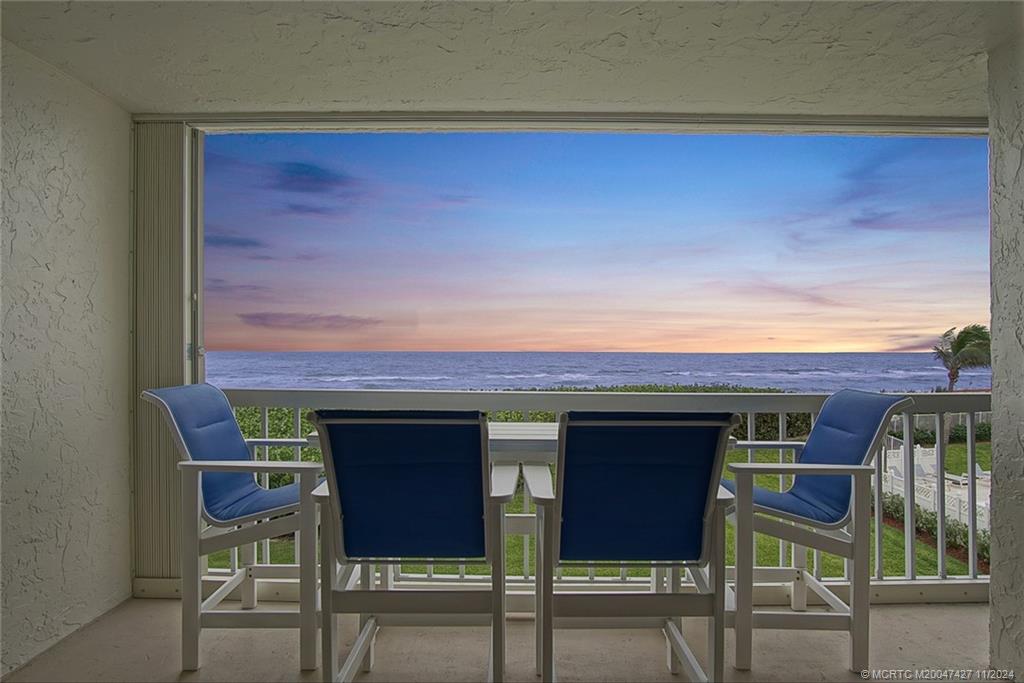 a view of an chairs and table in the patio