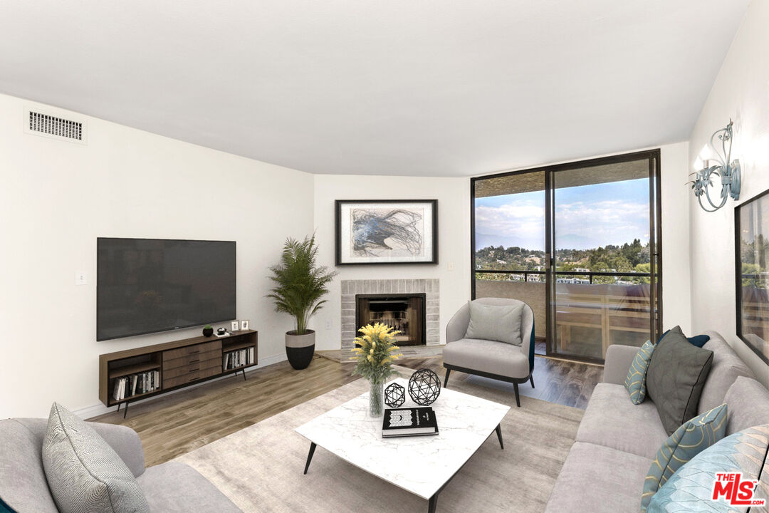 a living room with furniture a flat screen tv and a large window