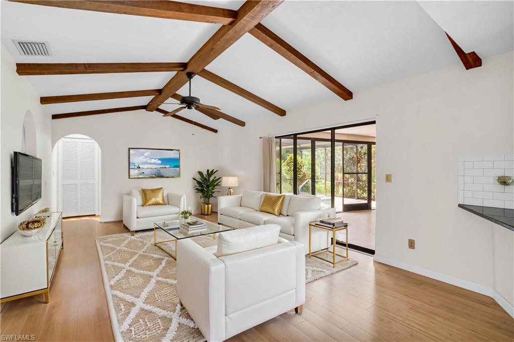 a living room with furniture and a window