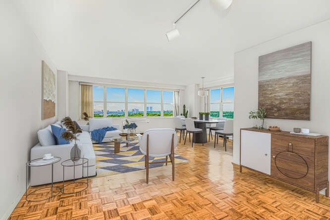 a living room with furniture and a large window