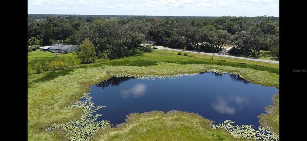 a view of a lake with a yard