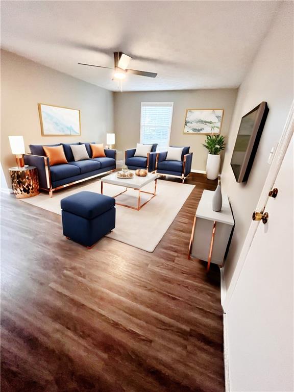 a living room with furniture and a flat screen tv