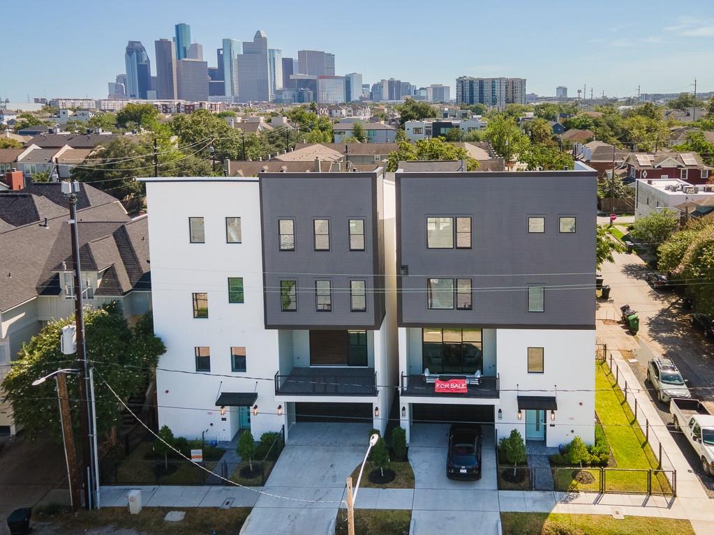 a aerial view of a house with a yard and sitting area