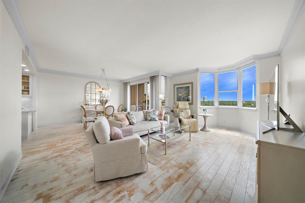 a living room with furniture window and wooden floor