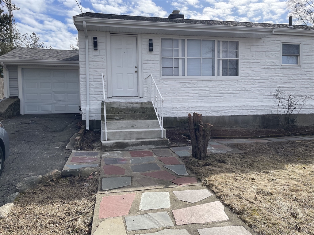 a front view of a house with garage