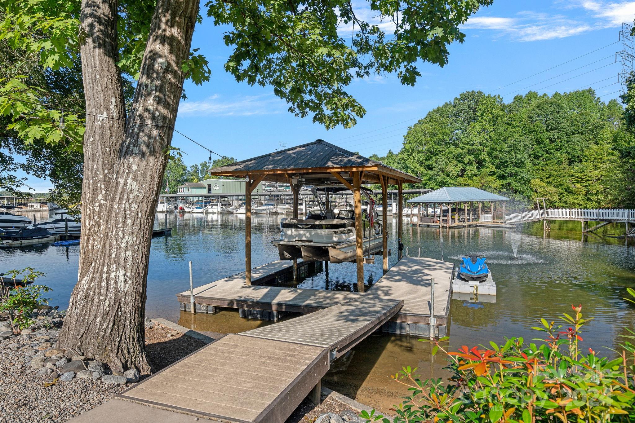 an outdoor space with swimming pool and furniture