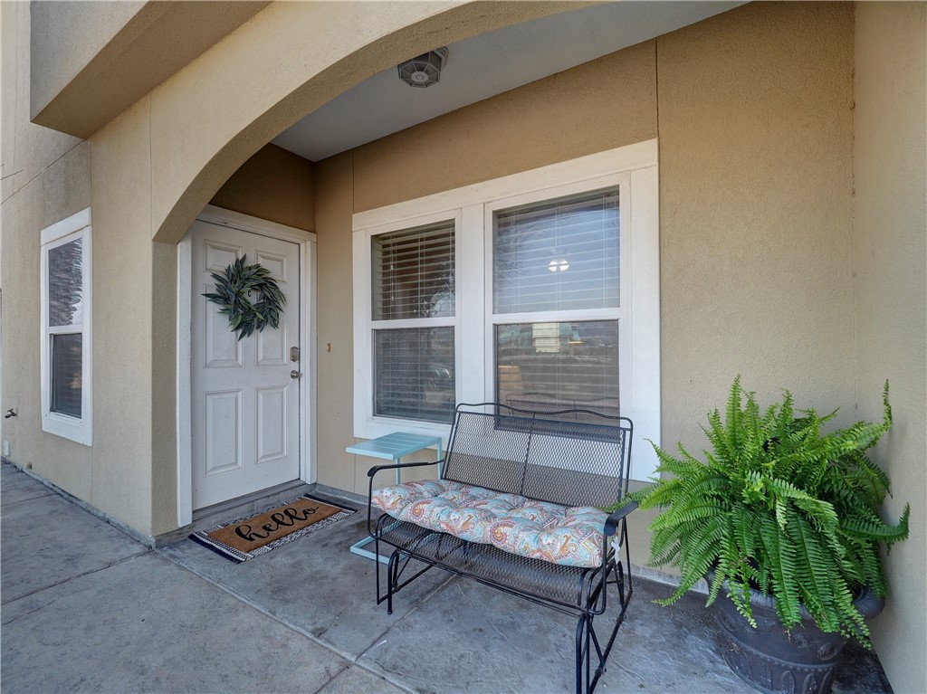 a outdoor living space with furniture and a potted plant